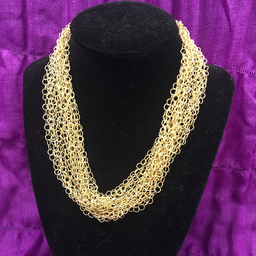 Gold multi chain necklace.